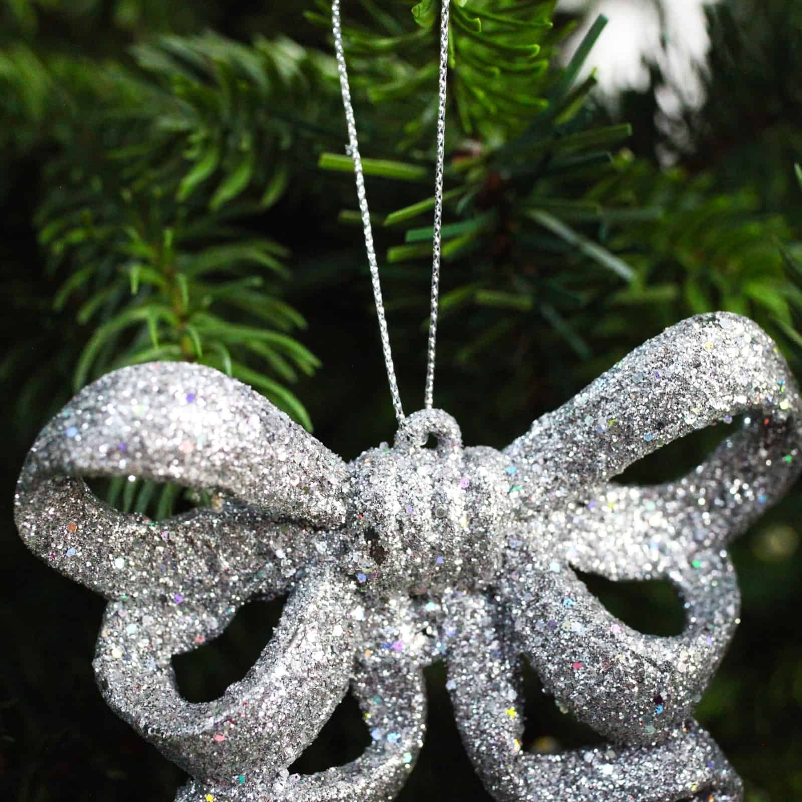 10 SILVER GLITTER BOWS 95mm